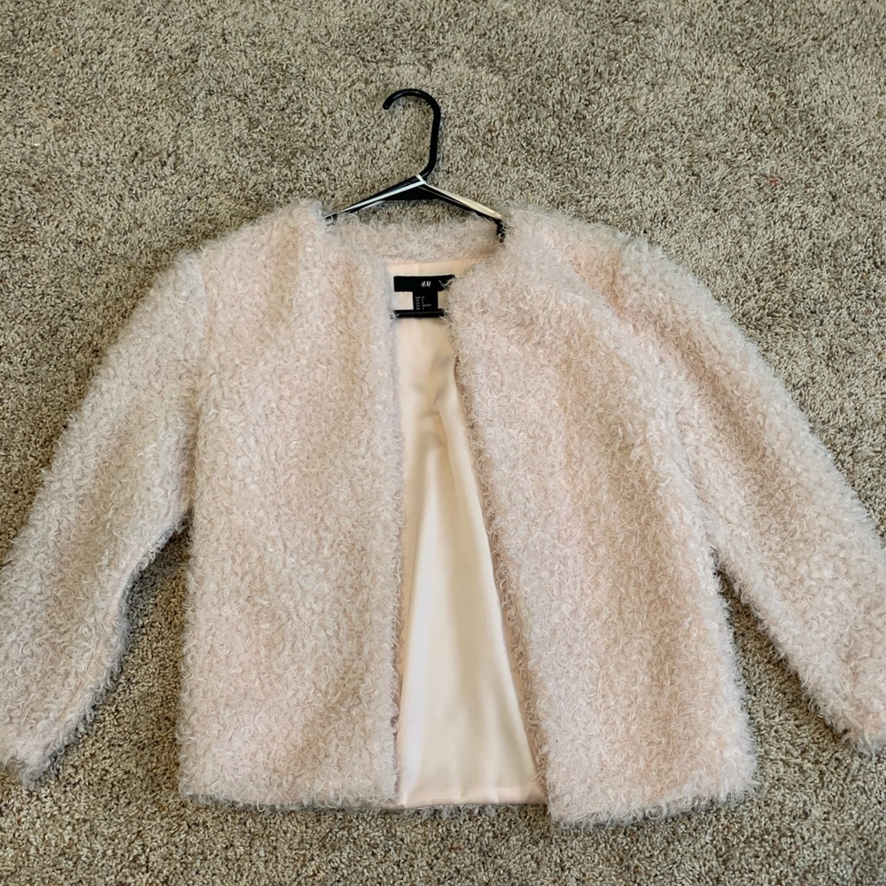 Blush fluffy teddy coat by H&M.